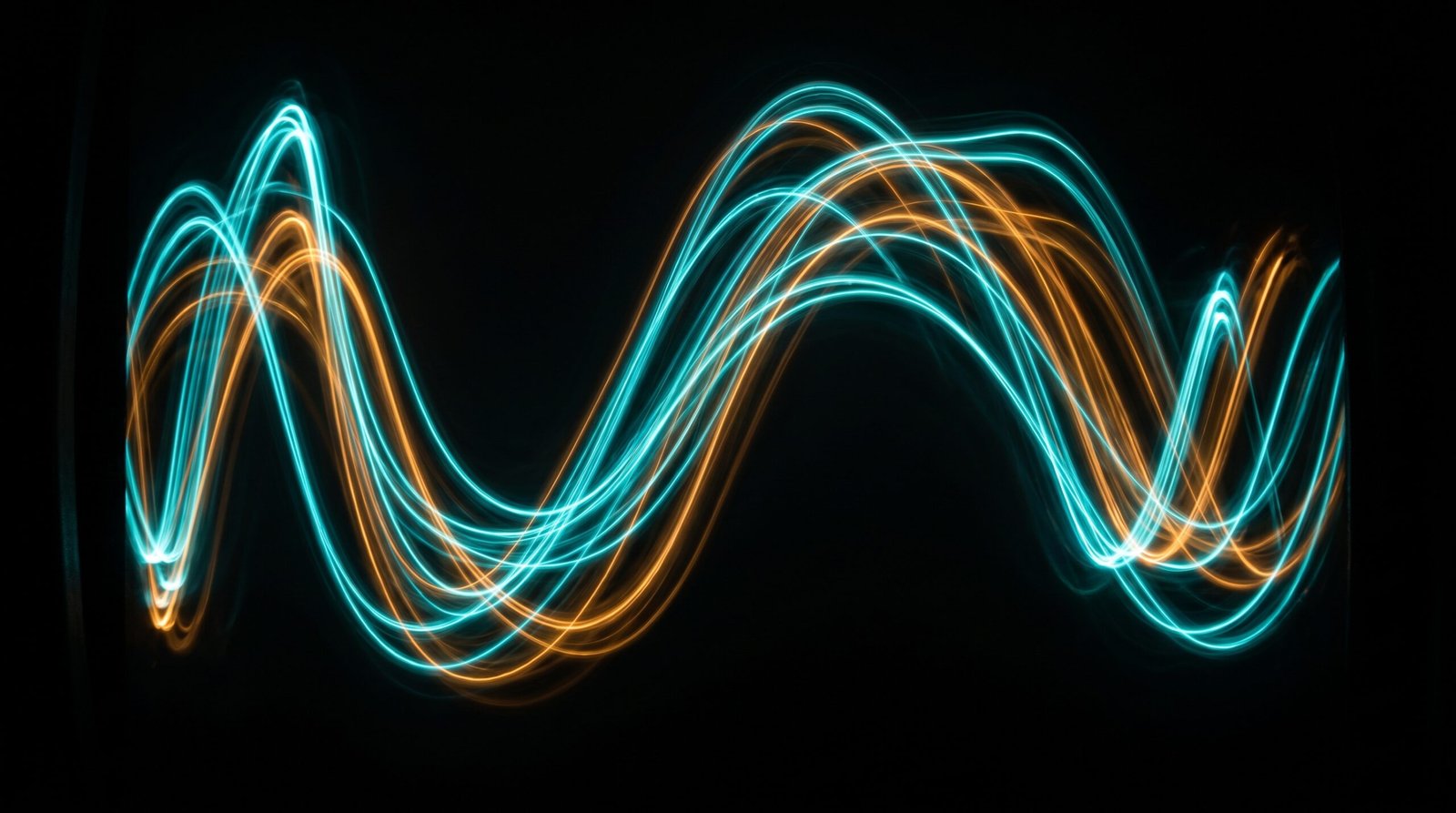 Abstract sound waveforms on a dark background