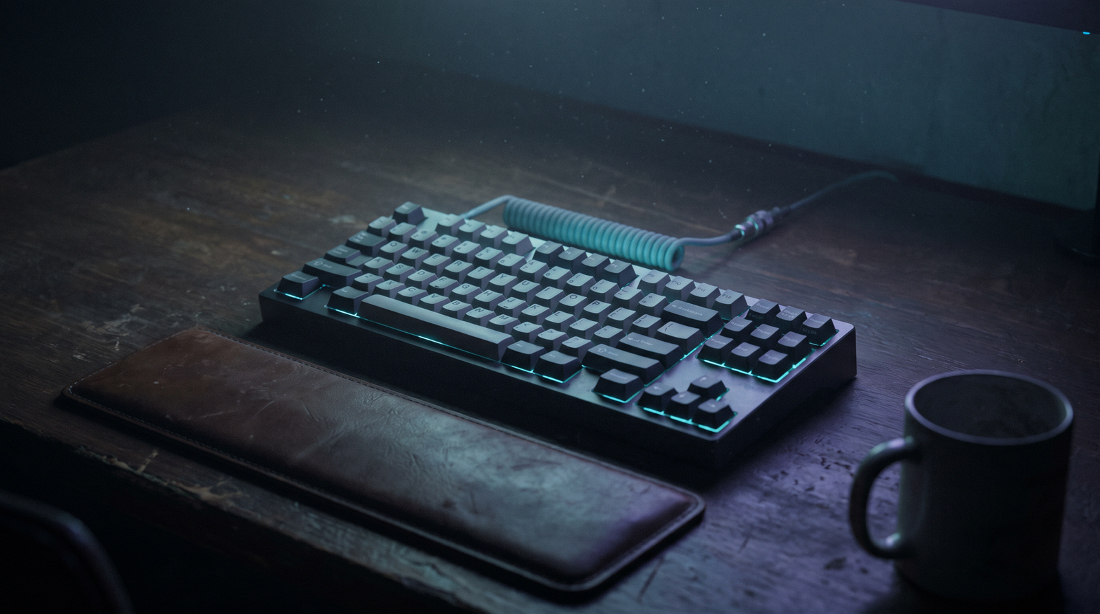 A single mechanical keyboard in dark moody lighting, dim cyan backlight visible between the keys, deep navy shadows, no people visible.